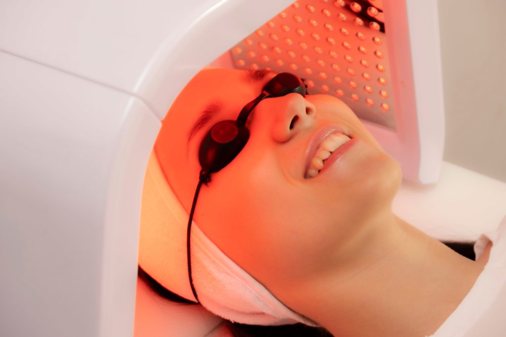 LED face therapy in cosmetology. Photo of LED therapy in red light | Beauty at First Sight Med Spa in Chicago, Illinois