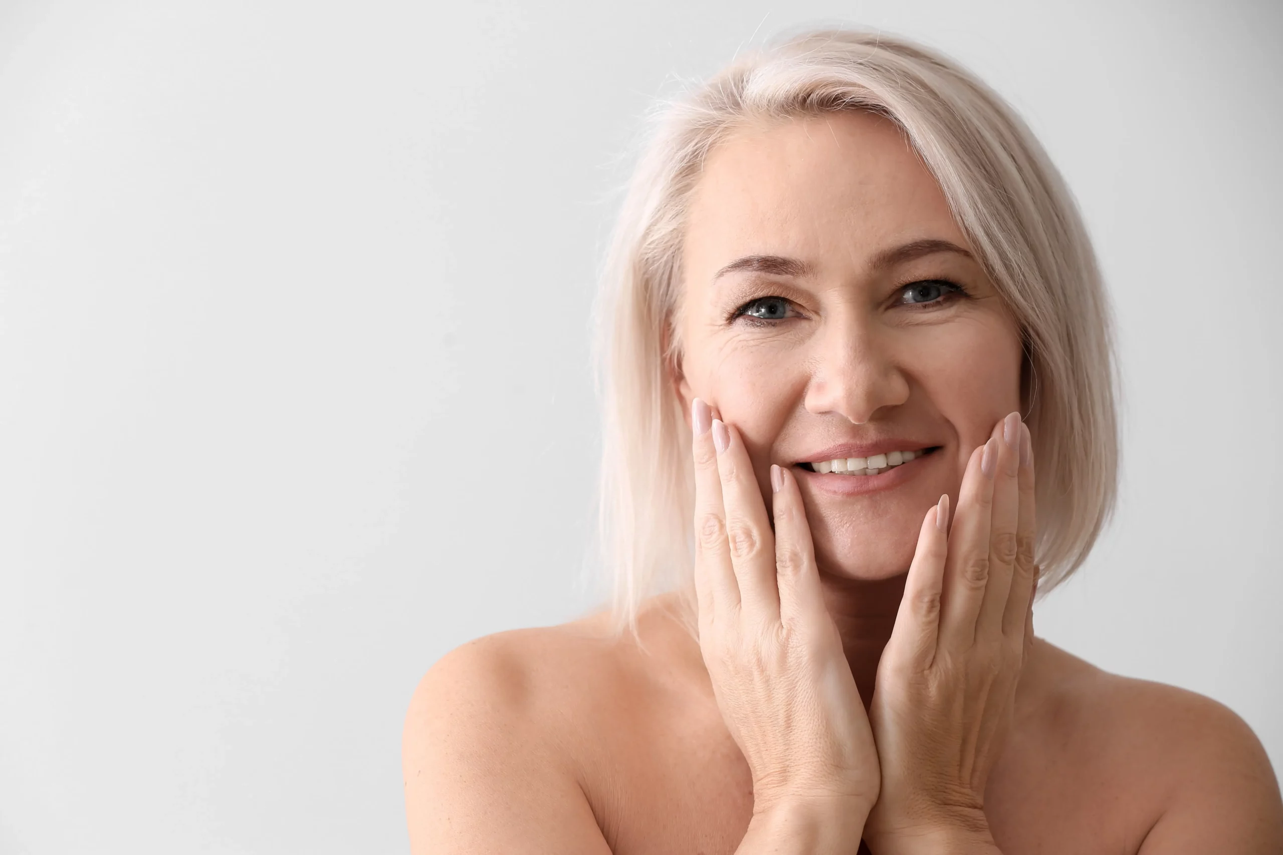 a woman with her hands on her face