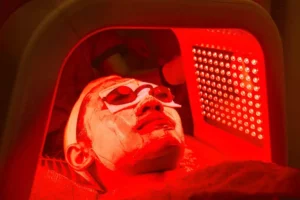 a person lying in a red light