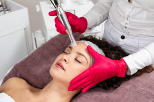 a woman receiving a facial treatment